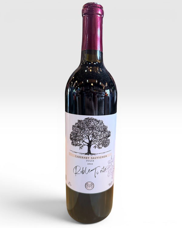 Licomar, Vinos y Licores Vino Tinto Roble Tinto Cabernet Dulce 750ml bottle with a tree illustration on the label.