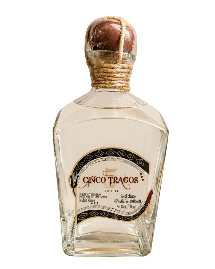 Licomar, Vinos y Licores Sotol Cinco Tragos Blanco 750ml bottle. Clear spirit with a rustic rope-tied wooden stopper.
